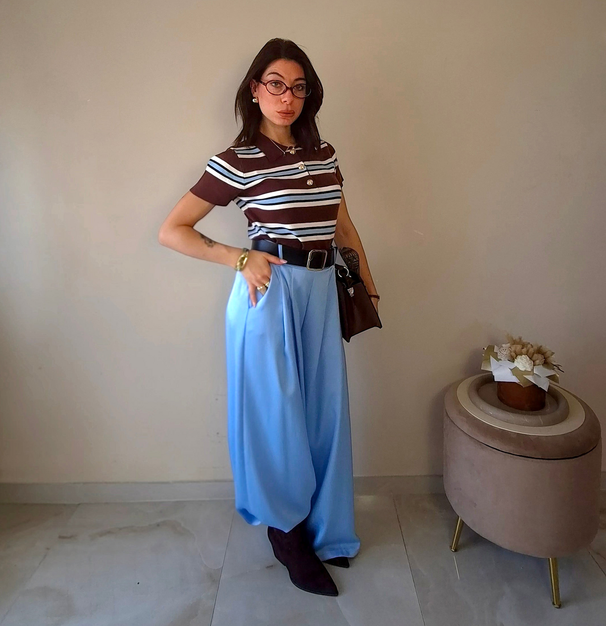 Claure Mode one-size light blue satin wide-leg trousers worn by a woman with a striped top and black belt