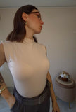 Top smanicato collo alto